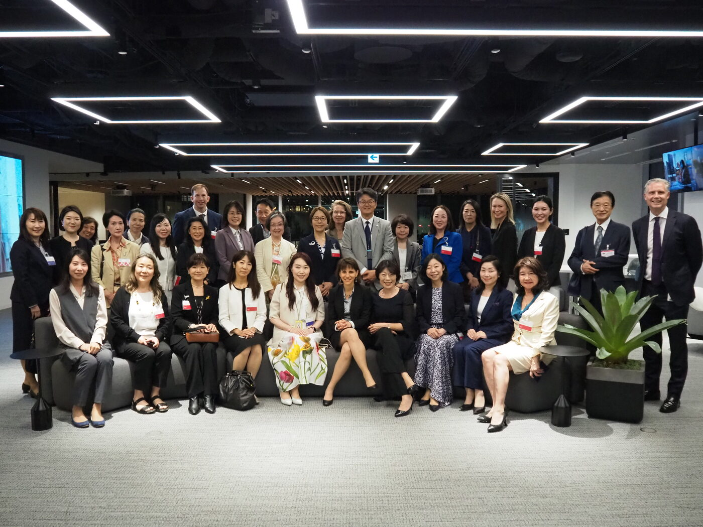 Diverse board leaders gathered in a Japanese boardroom